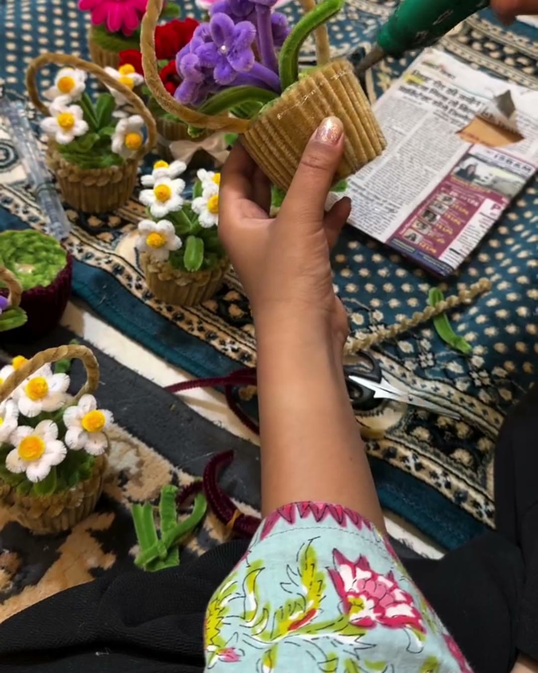 Soft chenille stems are bent, looped and twisted into petals, leaves and stems.