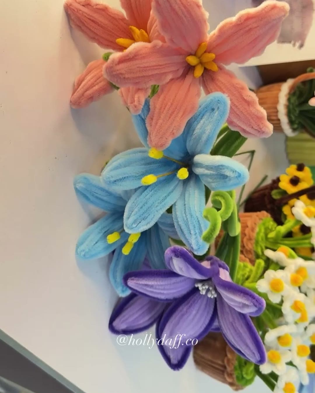 Handmade lilies against a wall