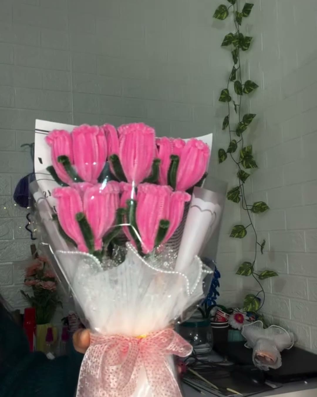 Bouquet of handmade pink roses in white wrap