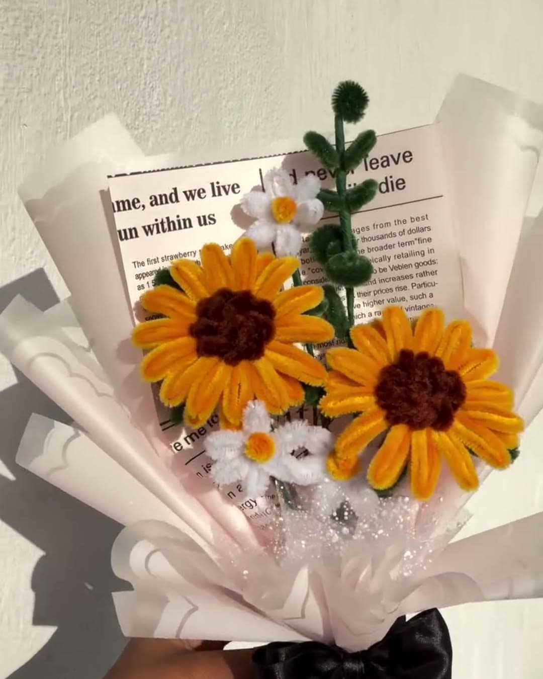 Handmade sunflower bouquet with daisies in blush wrap