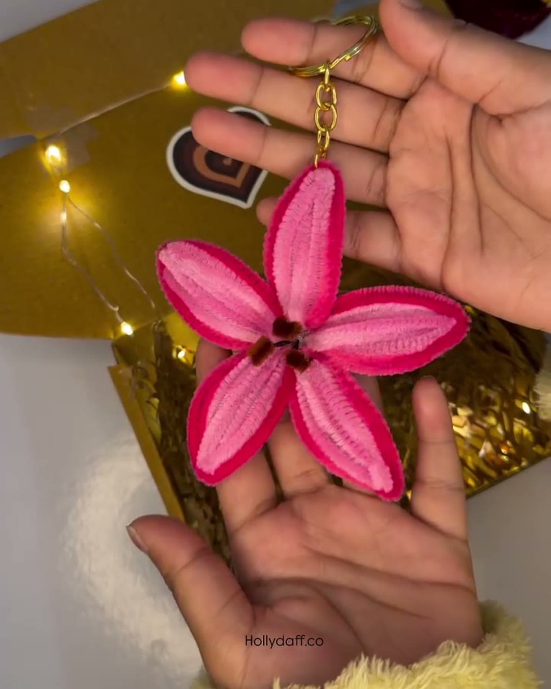 Pink lily keychain from the pink and yellow gift hamper