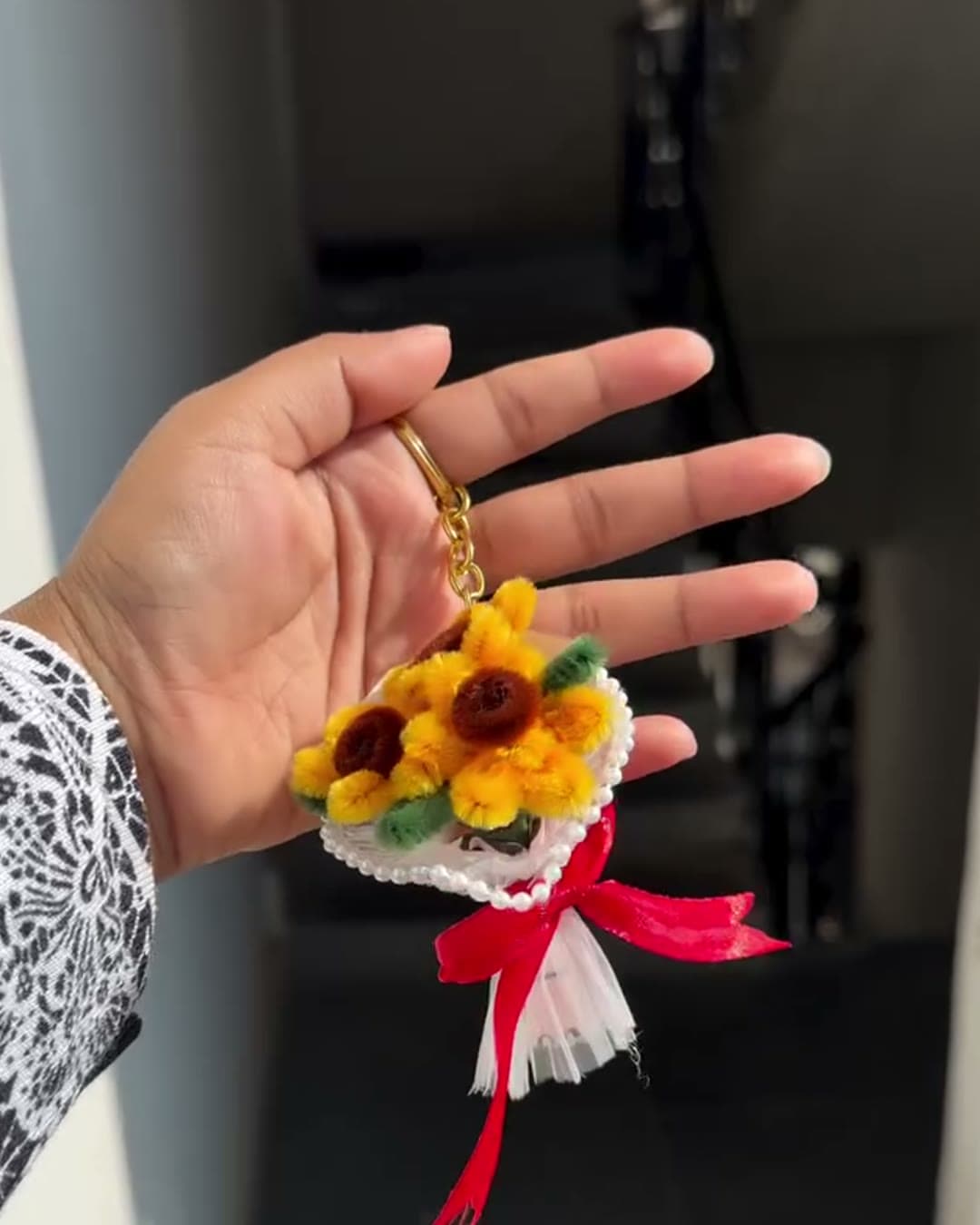 Mini sunflower bouquet keychain with red ribbon